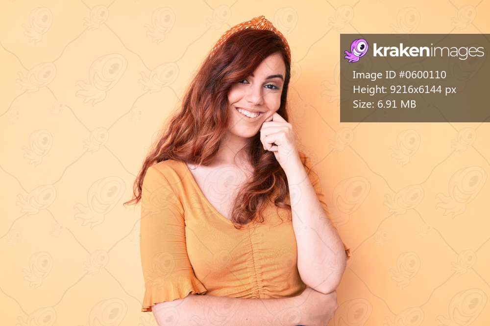 Young beautiful woman wearing casual clothes looking confident at the camera with smile with crossed arms and hand raised on chin. thinking positive. 