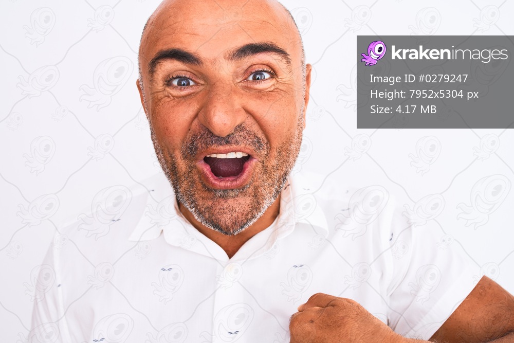 Middle age handsome man wearing elegant shirt standing over isolated white background with surprise face pointing finger to himself