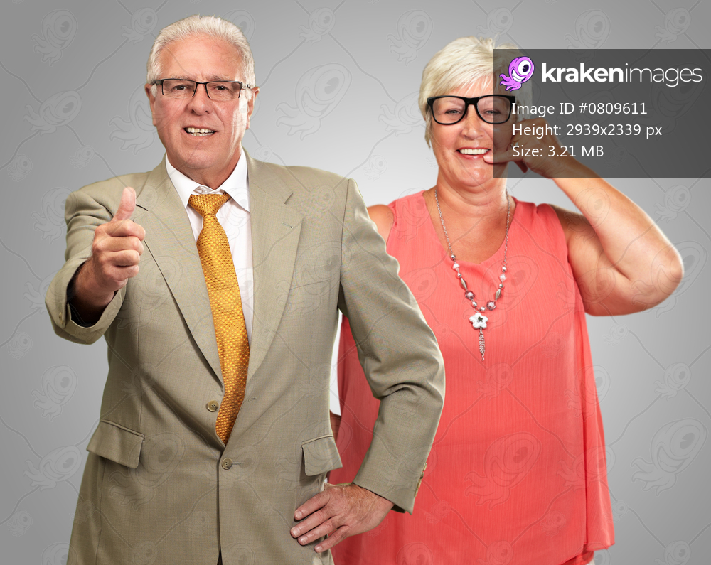 Happy Senior Couple Isolated On Gray Background