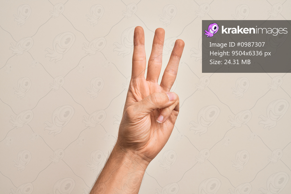 Hand of caucasian young man showing fingers over isolated white background counting number 3 showing three fingers