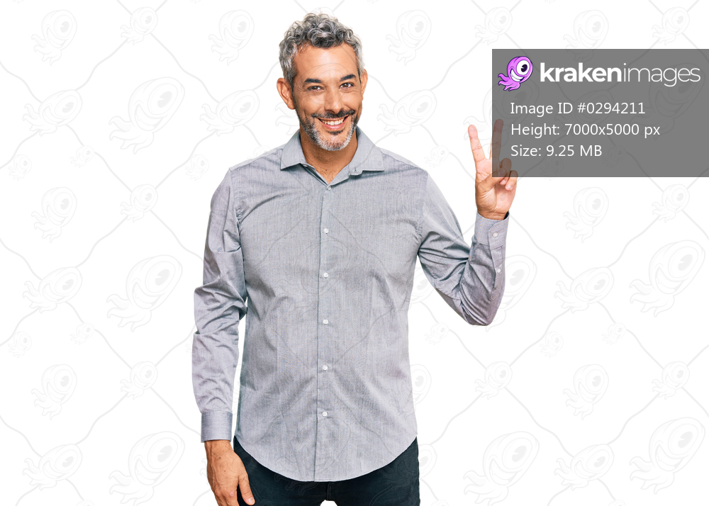 Middle age grey-haired man wearing casual clothes showing and pointing up with fingers number two while smiling confident and happy. 