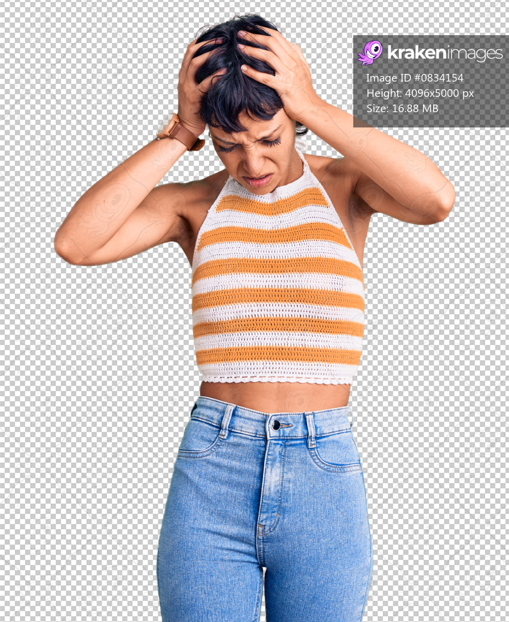 Young brunette woman with short hair wearing casual clothes suffering from headache desperate and stressed because pain and migraine. hands on head.