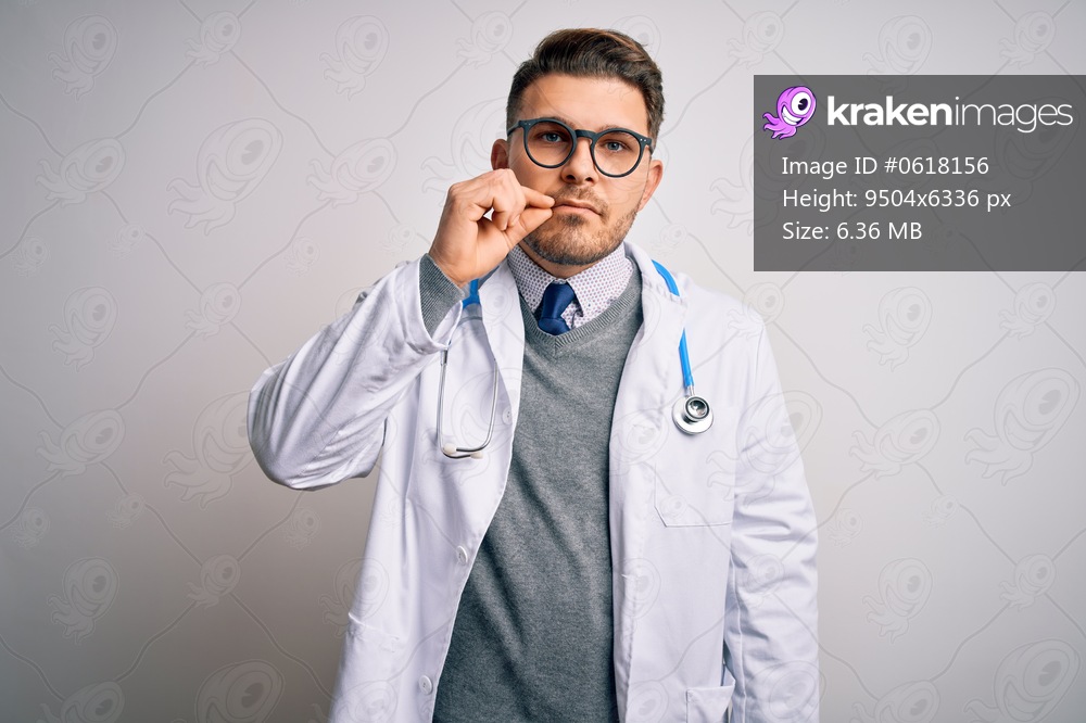 Young doctor man with blue eyes wearing medical coat and stethoscope over isolated background mouth and lips shut as zip with fingers. Secret and silent, taboo talking