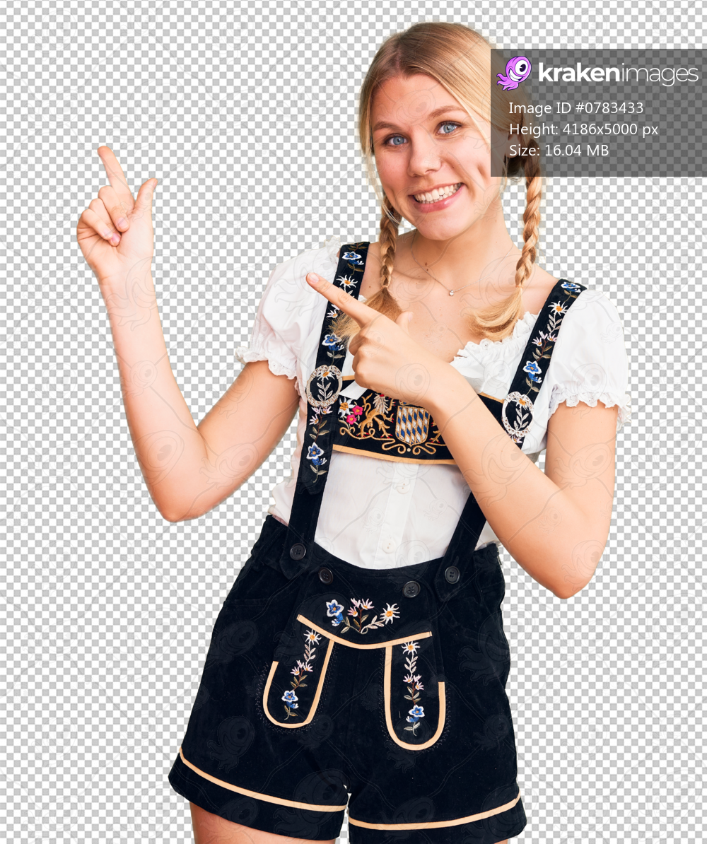 Young beautiful blonde woman wearing oktoberfest dress smiling and looking at the camera pointing with two hands and fingers to the side.
