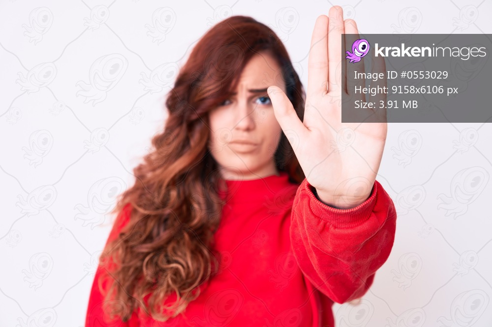 Young beautiful woman wearing casual clothes doing stop sing with palm of the hand. warning expression with negative and serious gesture on the face. 