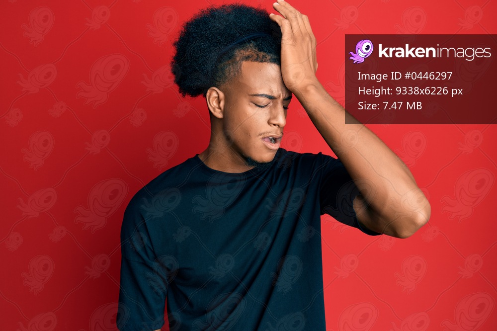 African american man with afro hair wearing casual clothes surprised with hand on head for mistake, remember error. forgot, bad memory concept. 