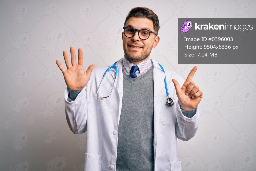 Young doctor man with blue eyes wearing medical coat and stethoscope over isolated background showing and pointing up with fingers number seven while smiling confident and happy.