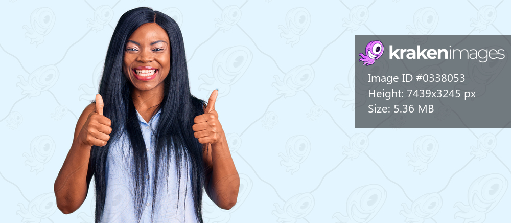 Young african american woman wearing casual clothes success sign doing positive gesture with hand, thumbs up smiling and happy. cheerful expression and winner gesture. 