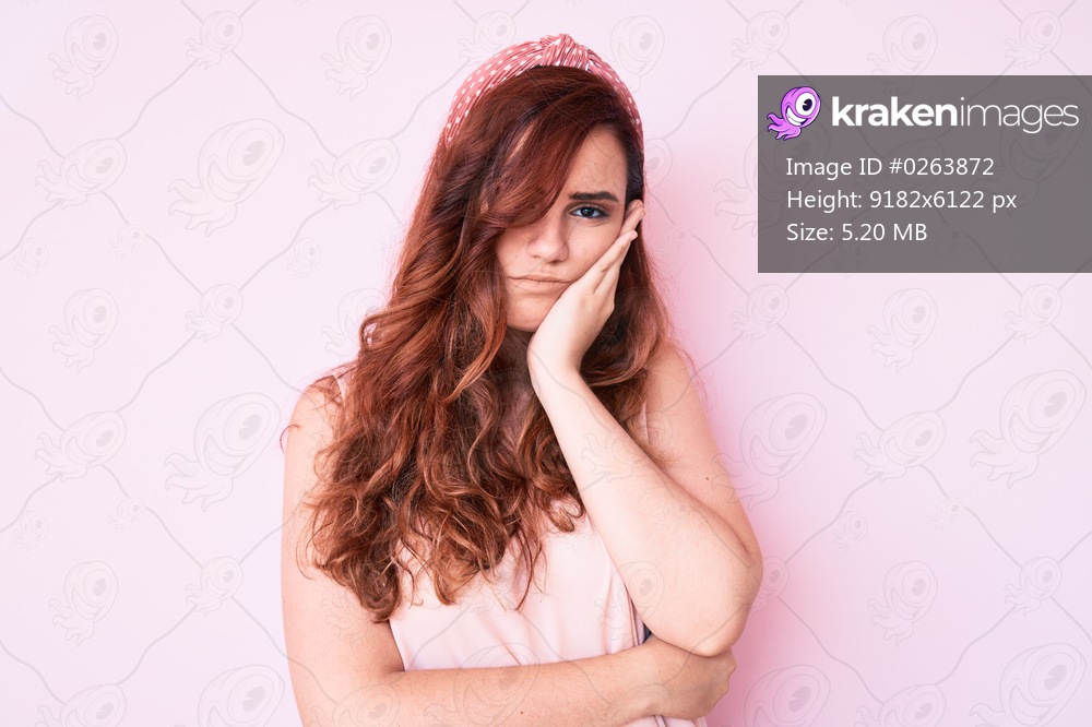 Young beautiful woman wearing casual clothes thinking looking tired and bored with depression problems with crossed arms. 