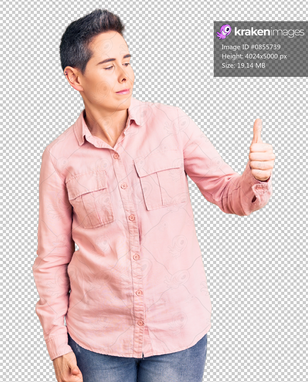 Young woman with short hair wearing casual clothes looking proud, smiling doing thumbs up gesture to the side