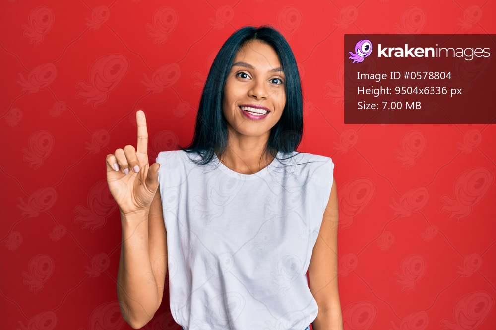 Young african american woman wearing casual clothes smiling with an idea or question pointing finger up with happy face, number one 