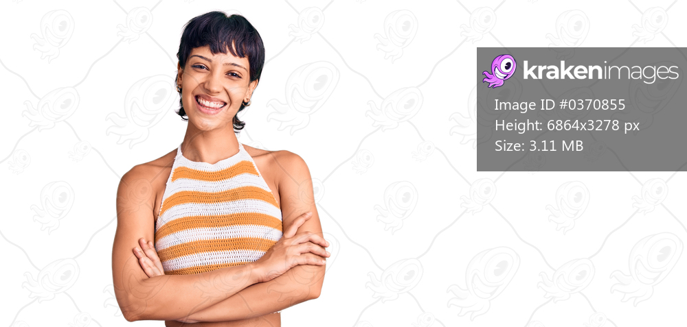 Young brunette woman with short hair wearing casual clothes happy face smiling with crossed arms looking at the camera. positive person. 