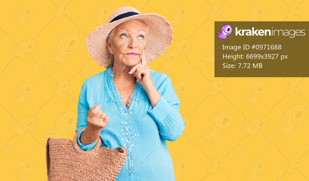 Senior beautiful woman with blue eyes and grey hair wearing fashion dress and hat holding summer wicker handbag serious face thinking about question with hand on chin, thoughtful about confusing idea 