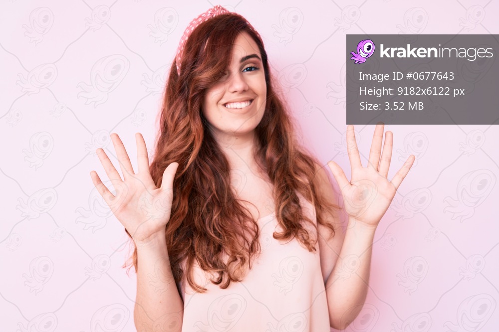 Young beautiful woman wearing casual clothes showing and pointing up with fingers number ten while smiling confident and happy. 