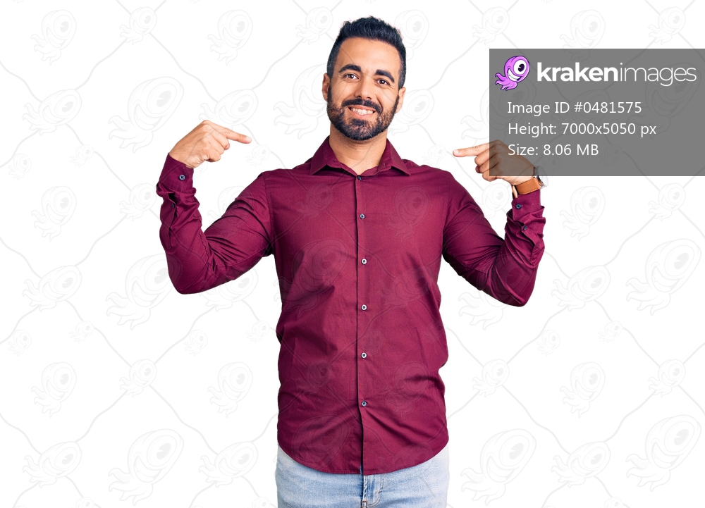 Young hispanic man wearing casual clothes looking confident with smile on face, pointing oneself with fingers proud and happy. 