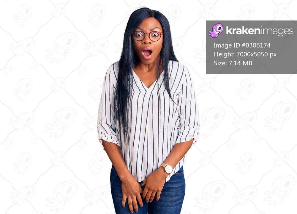 Young african american woman wearing casual clothes and glasses afraid and shocked with surprise and amazed expression, fear and excited face. 