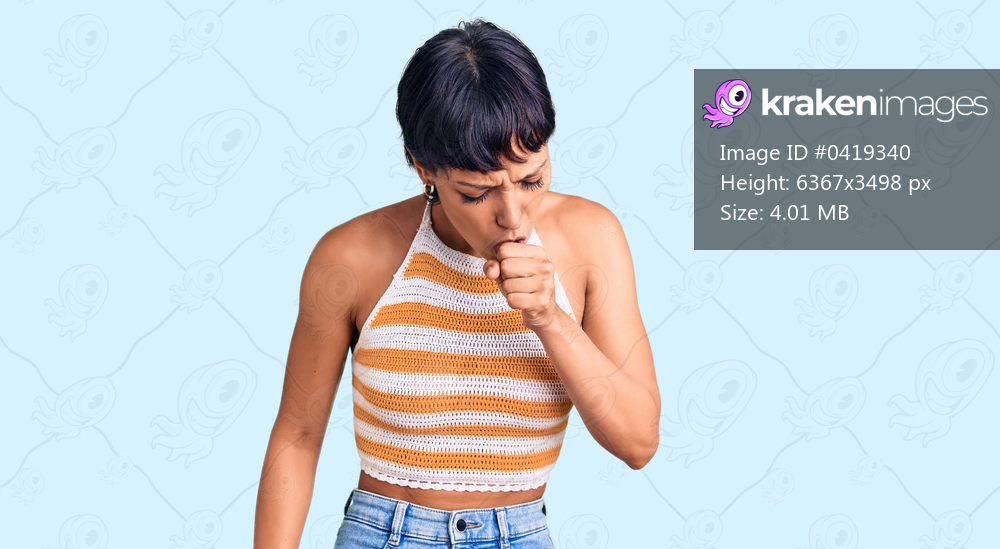 Young brunette woman with short hair wearing casual clothes feeling unwell and coughing as symptom for cold or bronchitis. health care concept. 