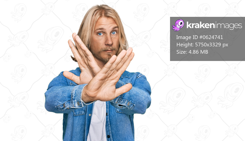 Caucasian man with blond long hair wearing casual denim jacket rejection expression crossing arms doing negative sign, angry face 