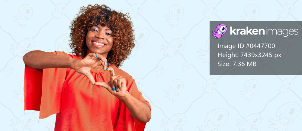 Young african american woman wearing casual clothes smiling in love doing heart symbol shape with hands. romantic concept. 