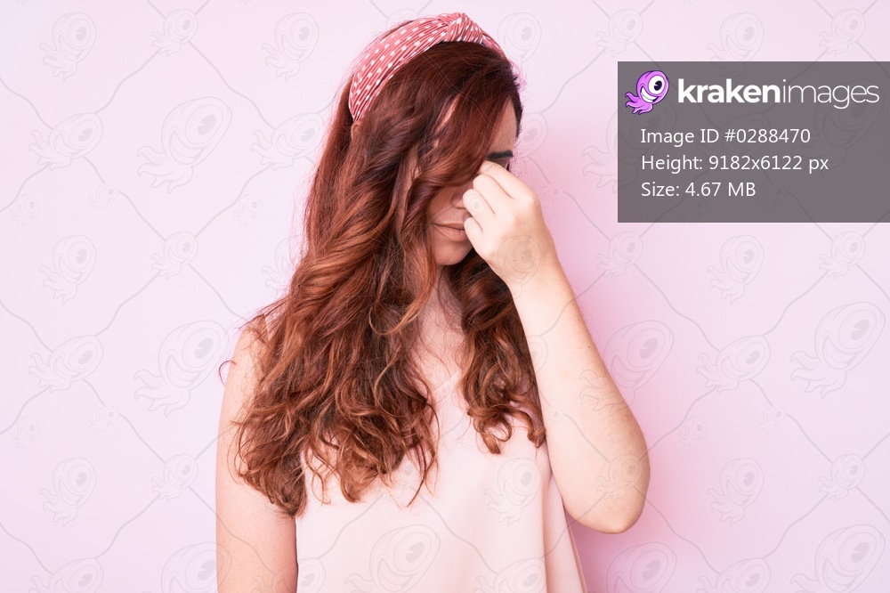 Young beautiful woman wearing casual clothes tired rubbing nose and eyes feeling fatigue and headache. stress and frustration concept. 