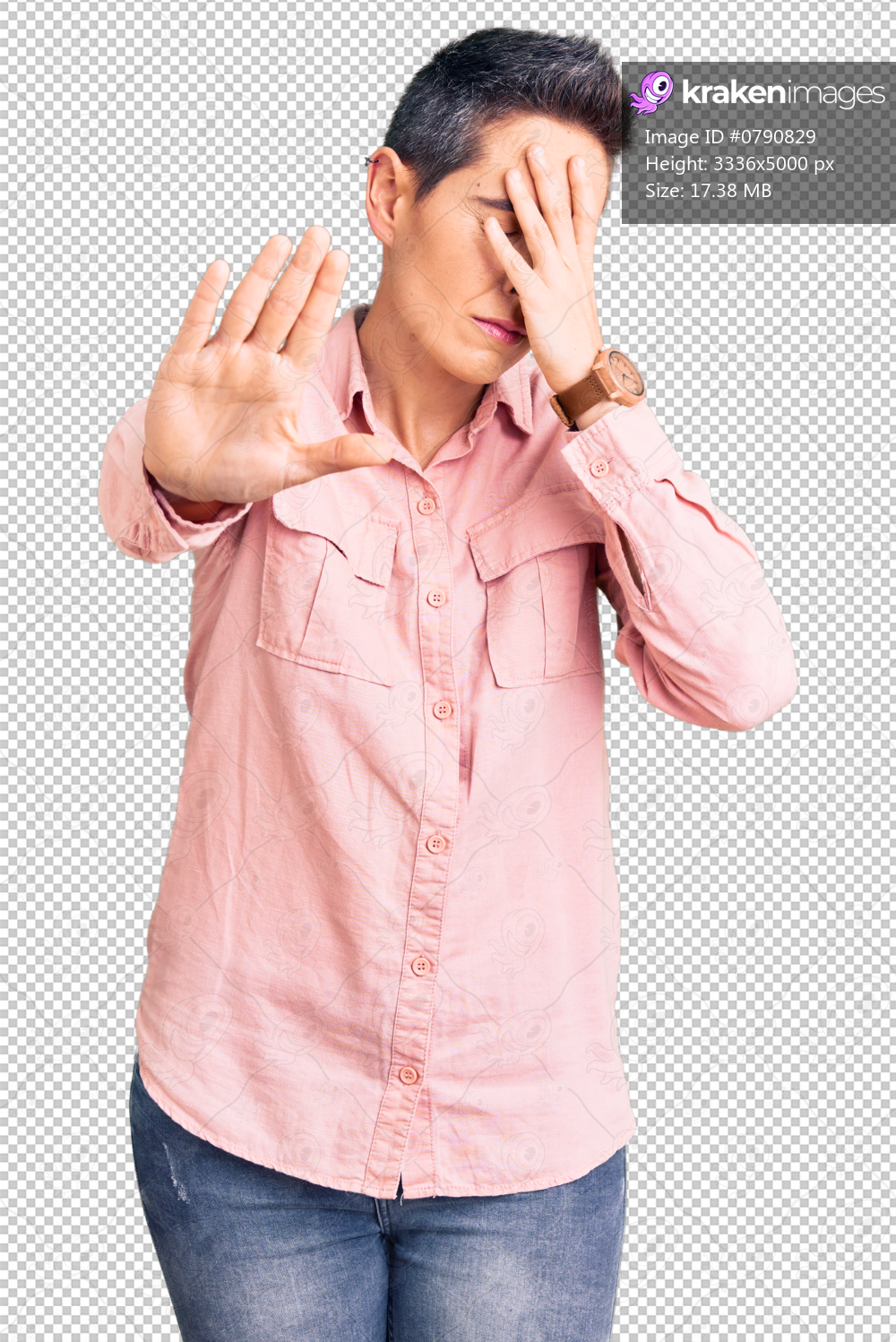 Young woman with short hair wearing casual clothes covering eyes with hands and doing stop gesture with sad and fear expression. embarrassed and negative concept.
