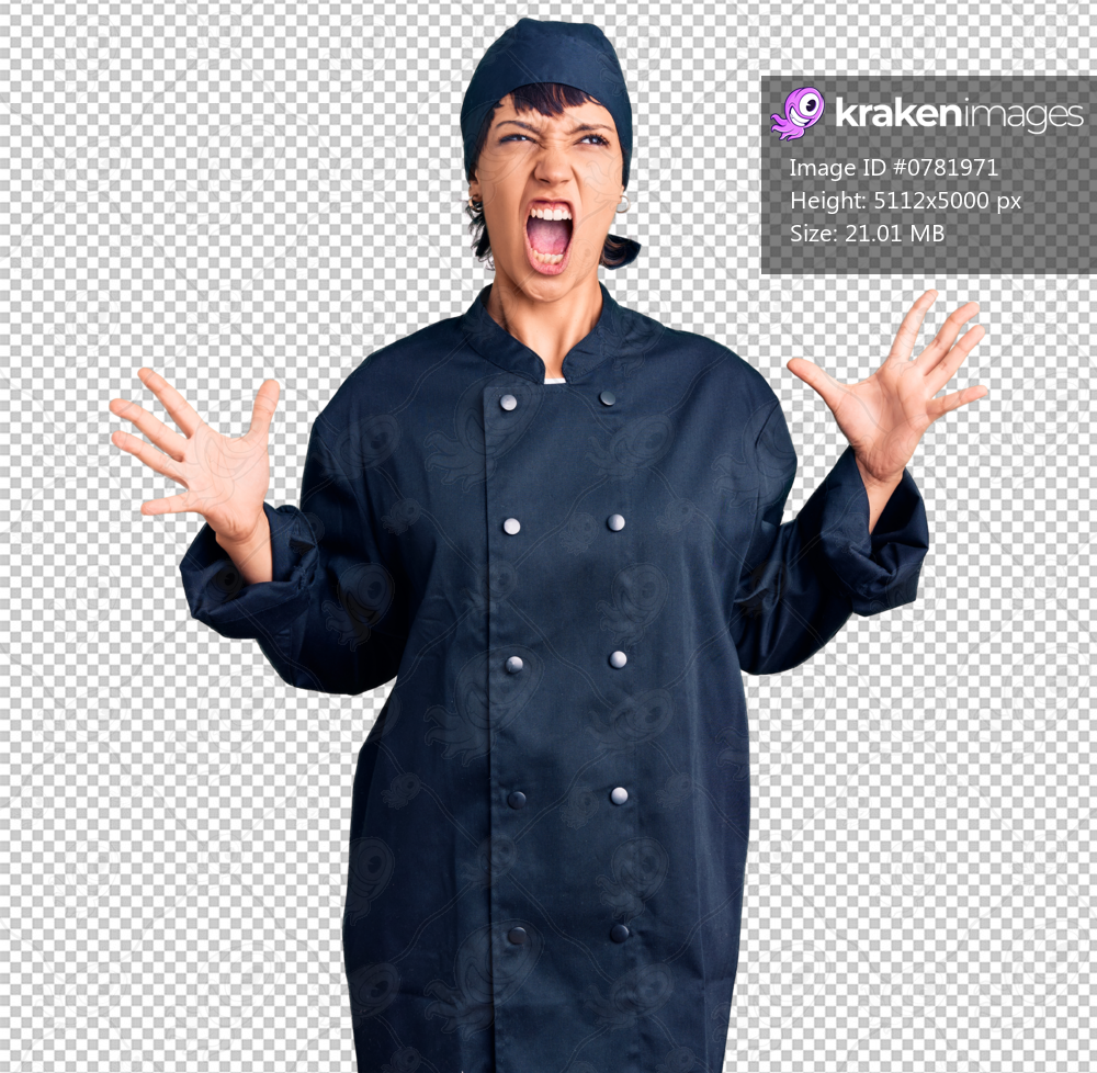 Young brunette woman with short hair wearing professional cook uniform crazy and mad shouting and yelling with aggressive expression and arms raised. frustration concept.