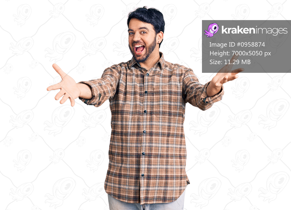 Young hispanic man wearing casual clothes smiling cheerful offering hands giving assistance and acceptance. 