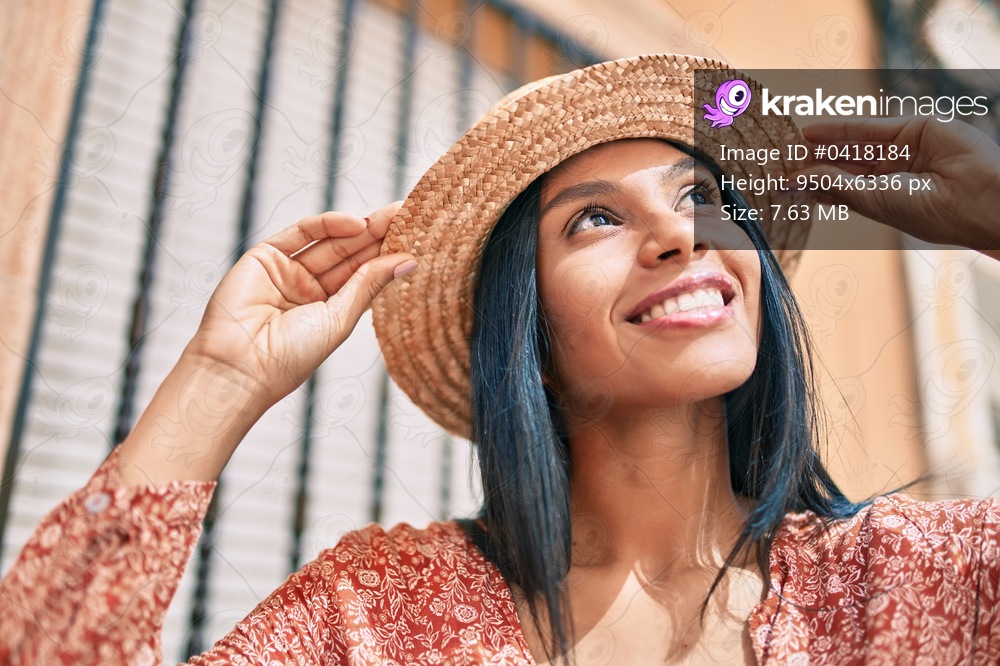 Young african american tourist woman on vacation smiling happy walking at the city.