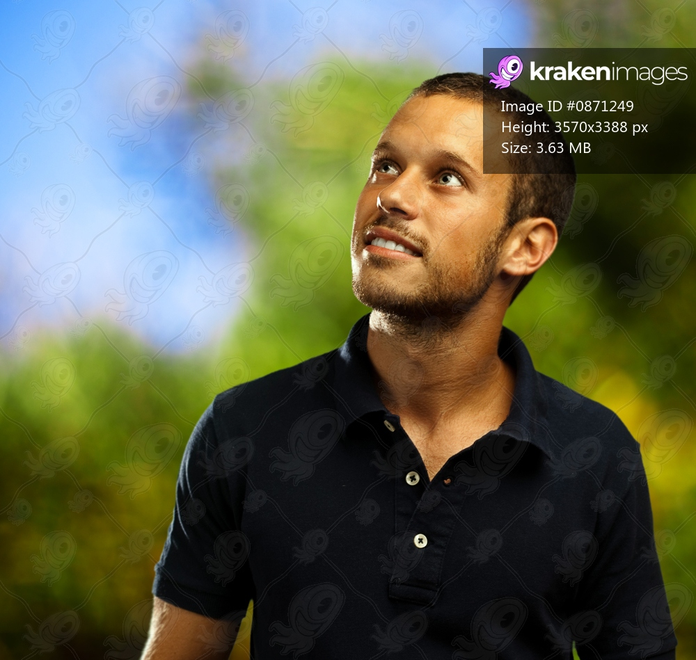 man smiling on a forest background