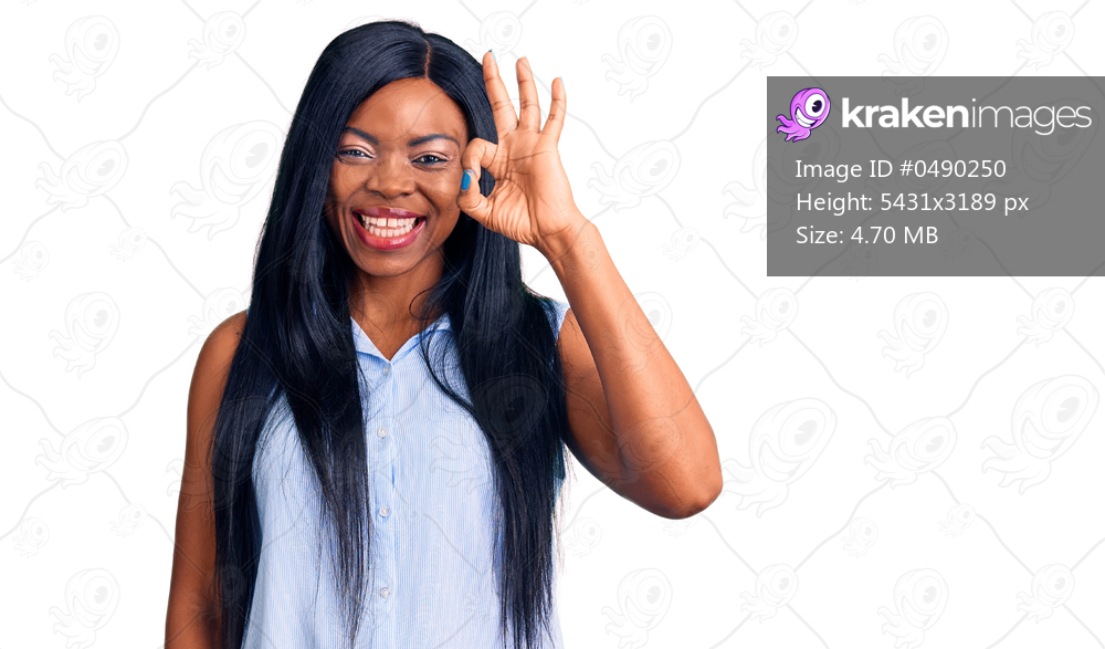 Young african american woman wearing casual clothes smiling positive doing ok sign with hand and fingers. successful expression. 