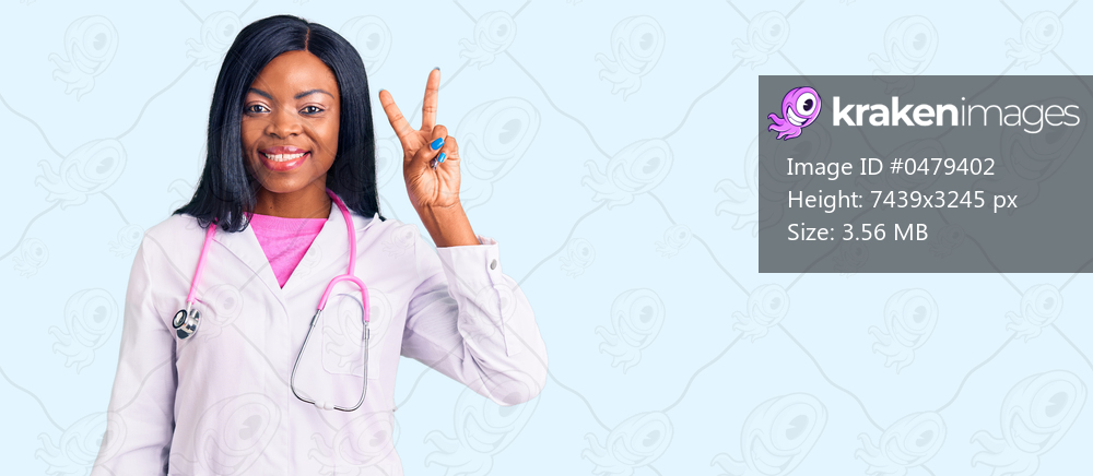 Young african american woman wearing doctor stethoscope smiling looking to the camera showing fingers doing victory sign. number two. 