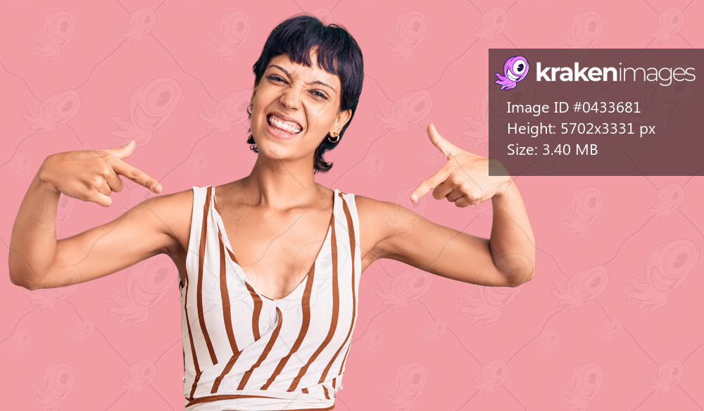 Young brunette woman with short hair wearing summer outfit looking confident with smile on face, pointing oneself with fingers proud and happy. 