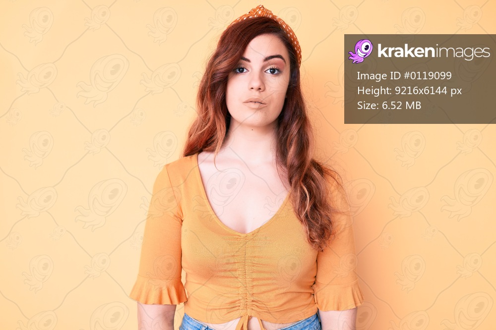 Young beautiful woman wearing casual clothes relaxed with serious expression on face. simple and natural looking at the camera. 