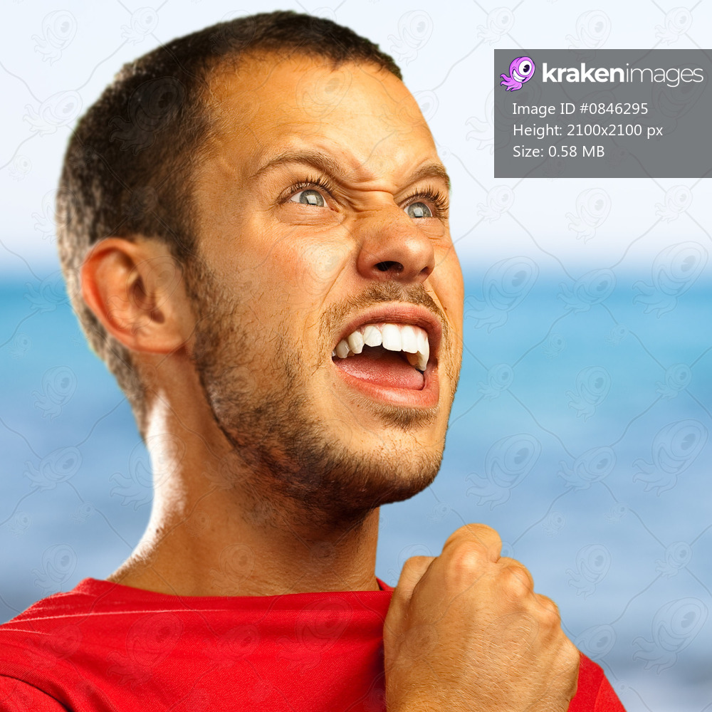 young man winner against a sea background