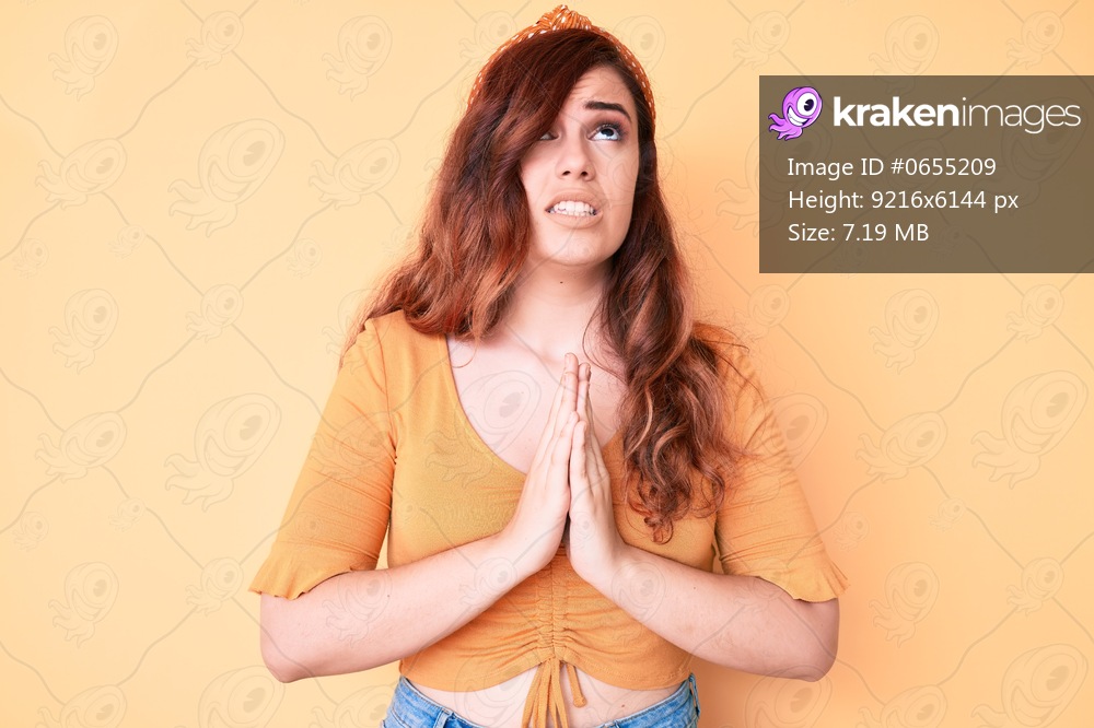 Young beautiful woman wearing casual clothes begging and praying with hands together with hope expression on face very emotional and worried. begging. 