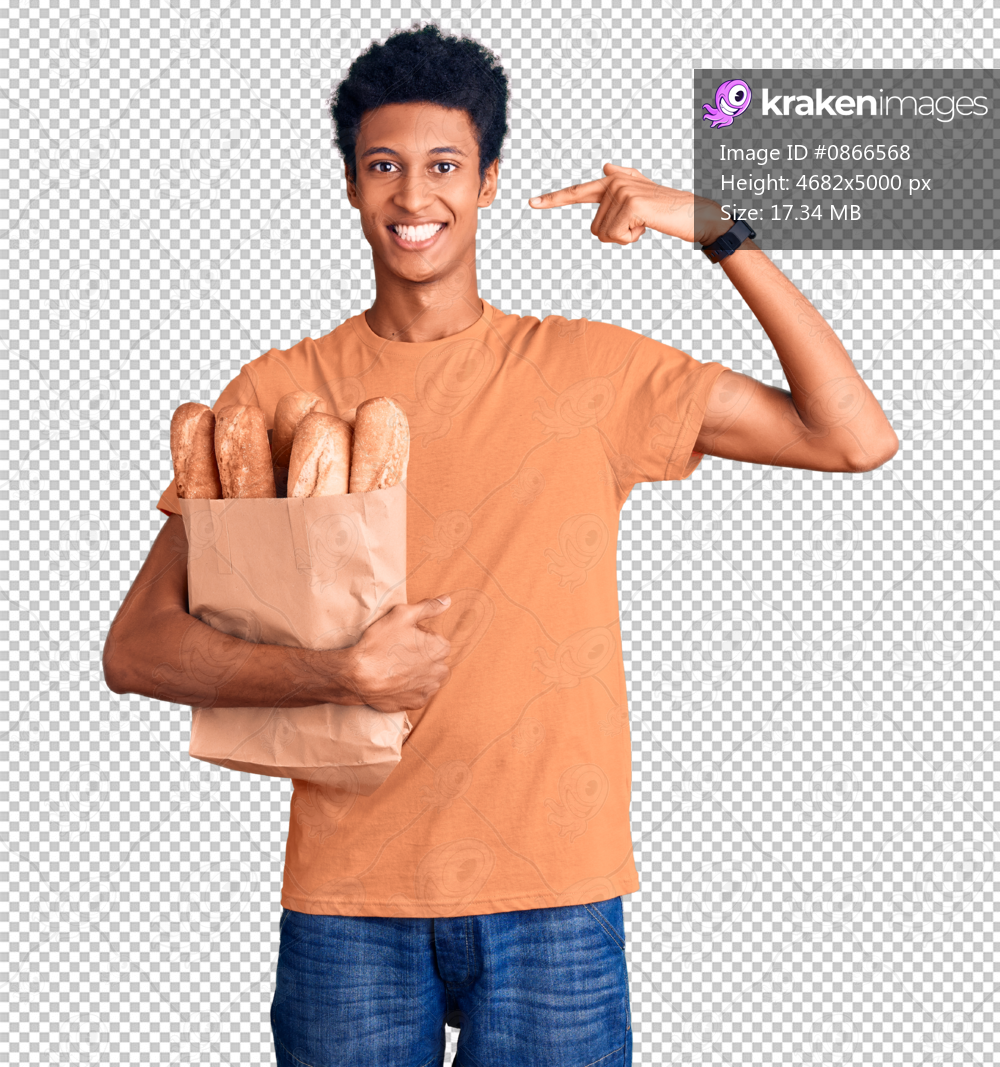Young african american man holding paper bag with bread smiling cheerful showing and pointing with fingers teeth and mouth. dental health concept.