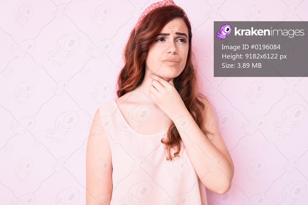 Young beautiful woman wearing casual clothes touching painful neck, sore throat for flu, clod and infection 