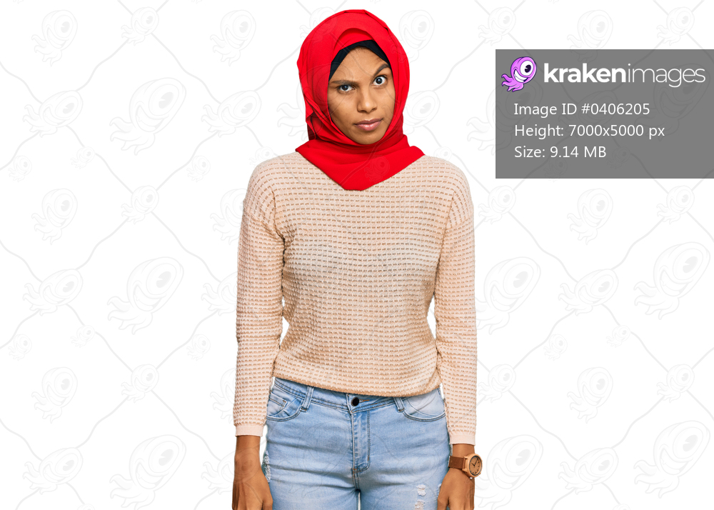 Young african american woman wearing traditional islamic hijab scarf skeptic and nervous, frowning upset because of problem. negative person. 