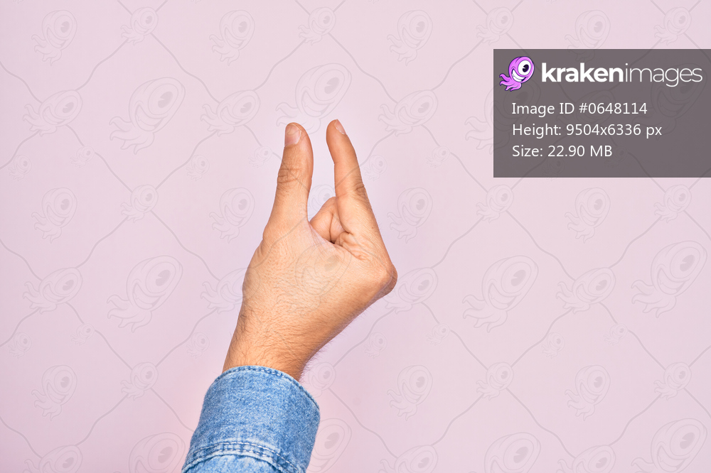 Hand of caucasian young man showing fingers over isolated pink background picking and taking invisible thing, holding object with fingers showing space