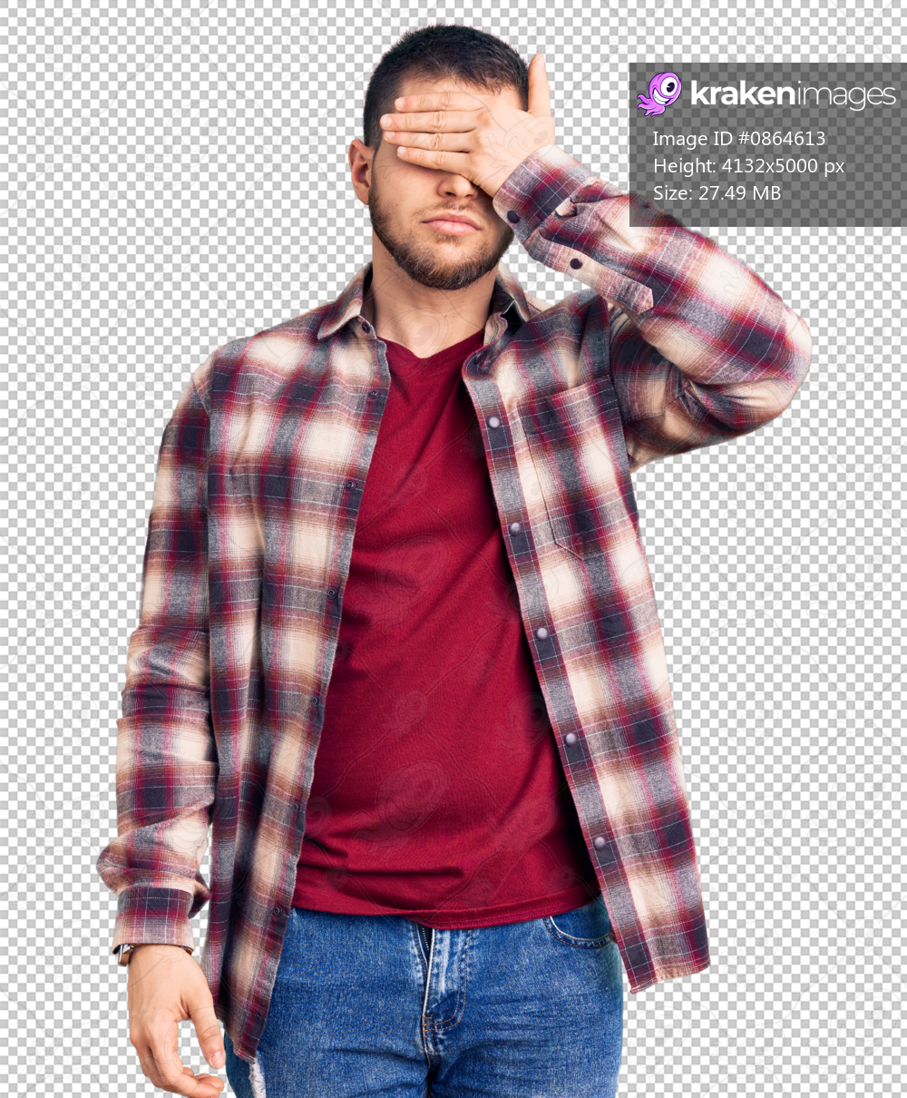 Young handsome man wearing casual shirt covering eyes with hand, looking serious and sad. sightless, hiding and rejection concept