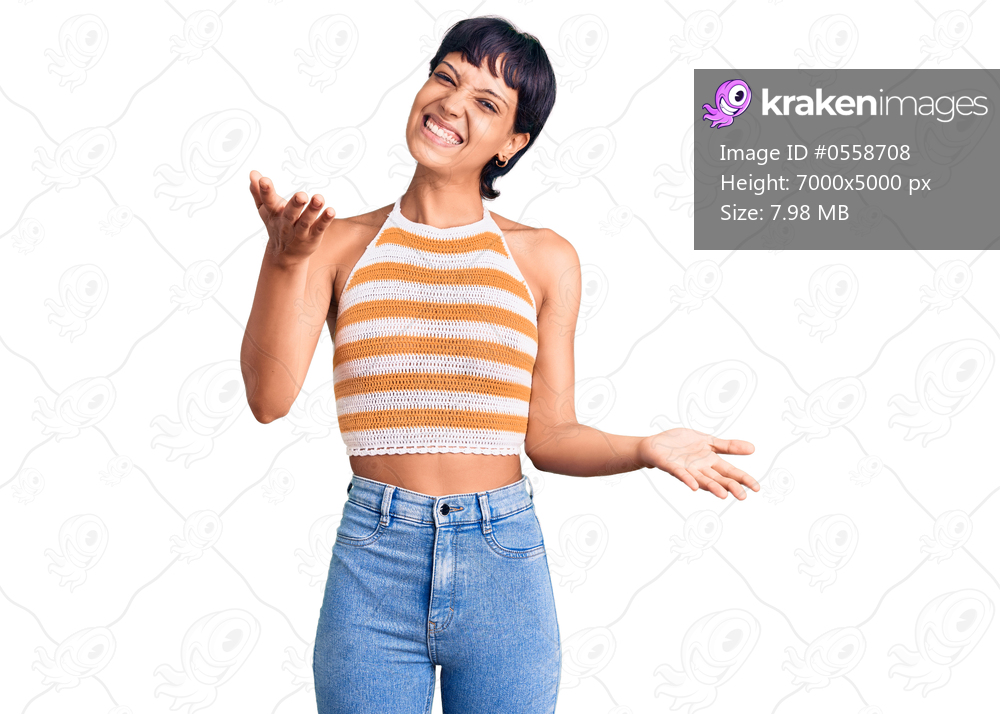 Young brunette woman with short hair wearing casual clothes smiling cheerful offering hands giving assistance and acceptance. 