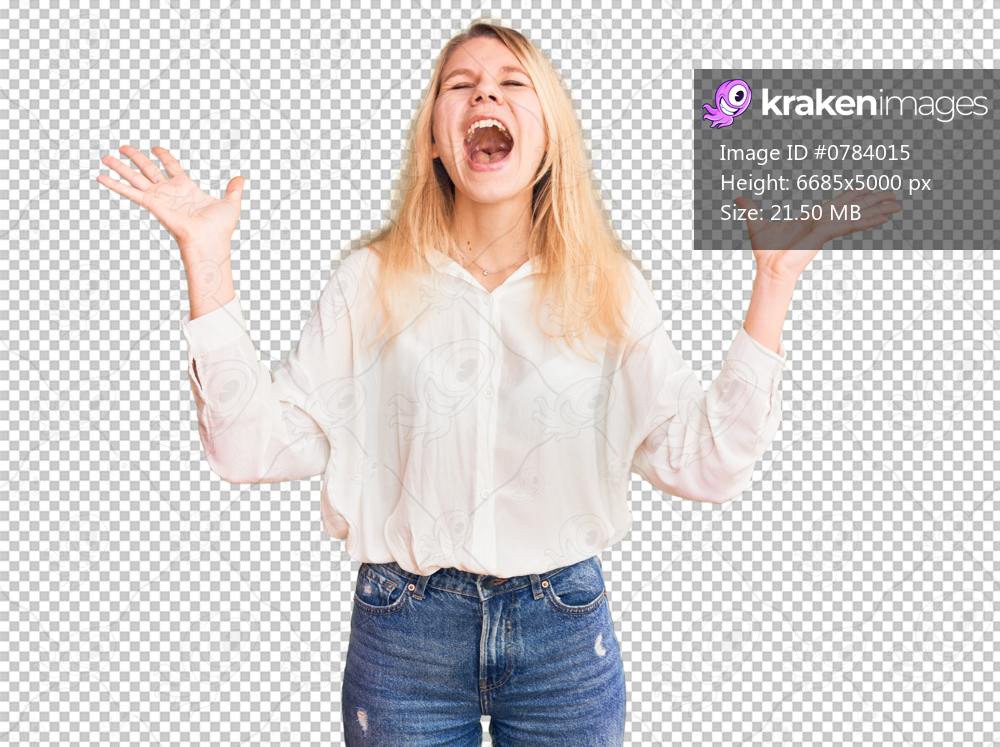 Young beautiful blonde woman wearing casual shirt celebrating mad and crazy for success with arms raised and closed eyes screaming excited. winner concept