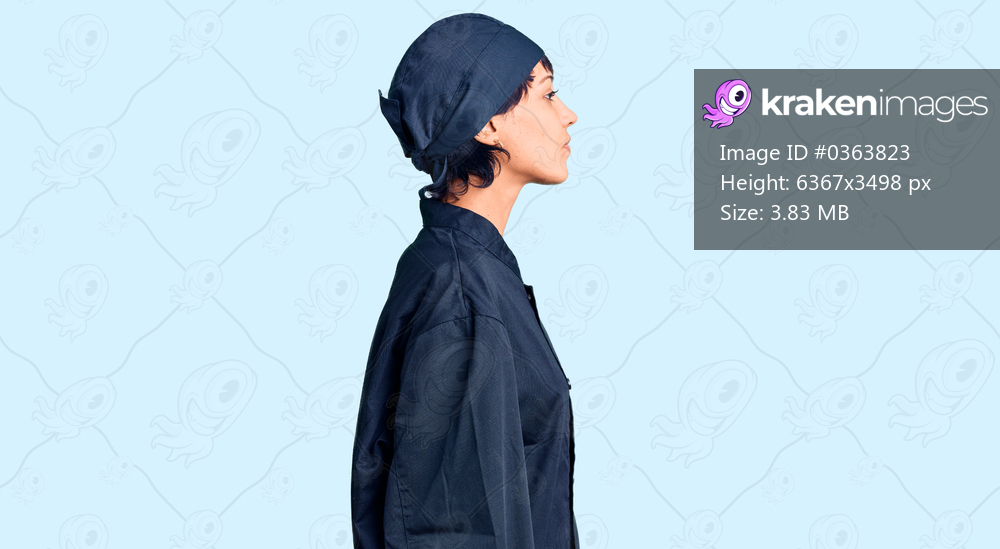 Young brunette woman with short hair wearing professional cook uniform looking to side, relax profile pose with natural face with confident smile. 