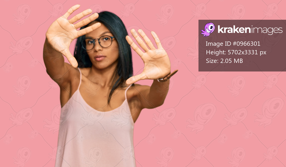 Young african american woman wearing casual clothes and glasses doing frame using hands palms and fingers, camera perspective 