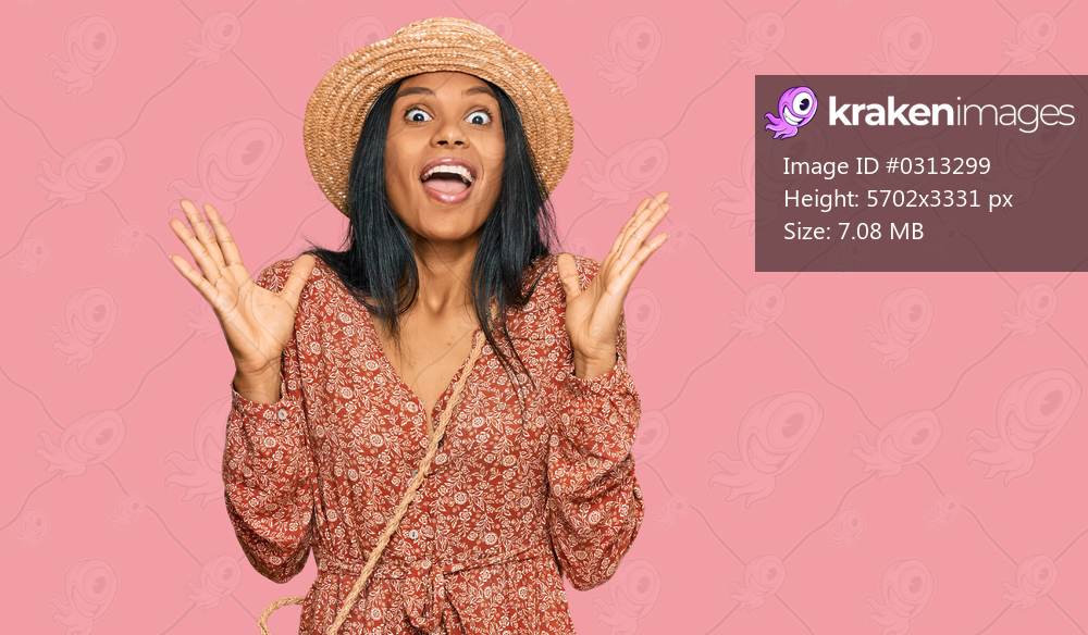 Young african american woman wearing summer hat celebrating crazy and amazed for success with arms raised and open eyes screaming excited. winner concept 