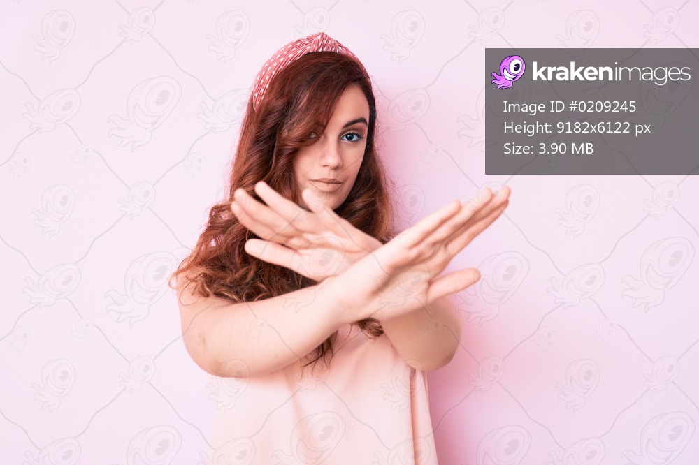 Young beautiful woman wearing casual clothes rejection expression crossing arms and palms doing negative sign, angry face 