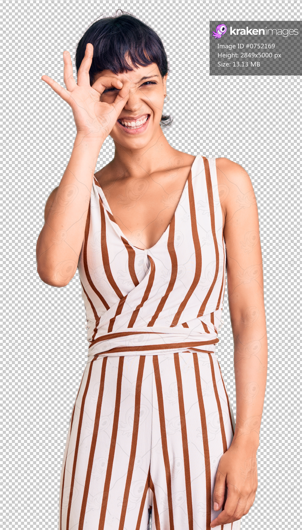 Young brunette woman with short hair wearing summer outfit doing ok gesture with hand smiling, eye looking through fingers with happy face.