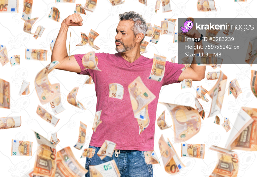 Middle age grey-haired man wearing casual clothes showing arms muscles smiling proud. fitness concept.