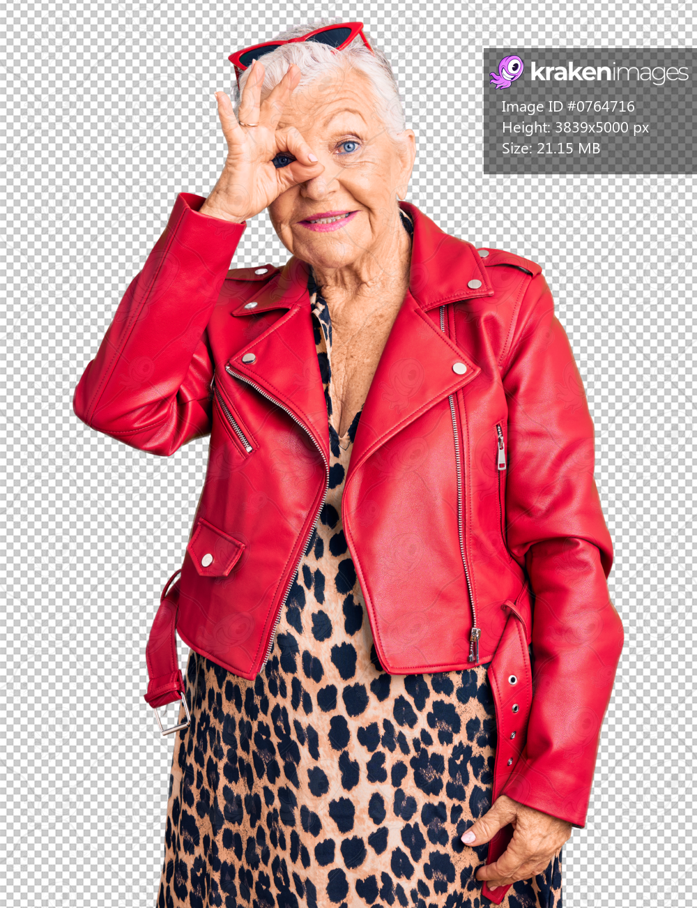 Senior beautiful woman with blue eyes and grey hair wearing a modern style with a red leather jacket smiling happy doing ok sign with hand on eye looking through fingers