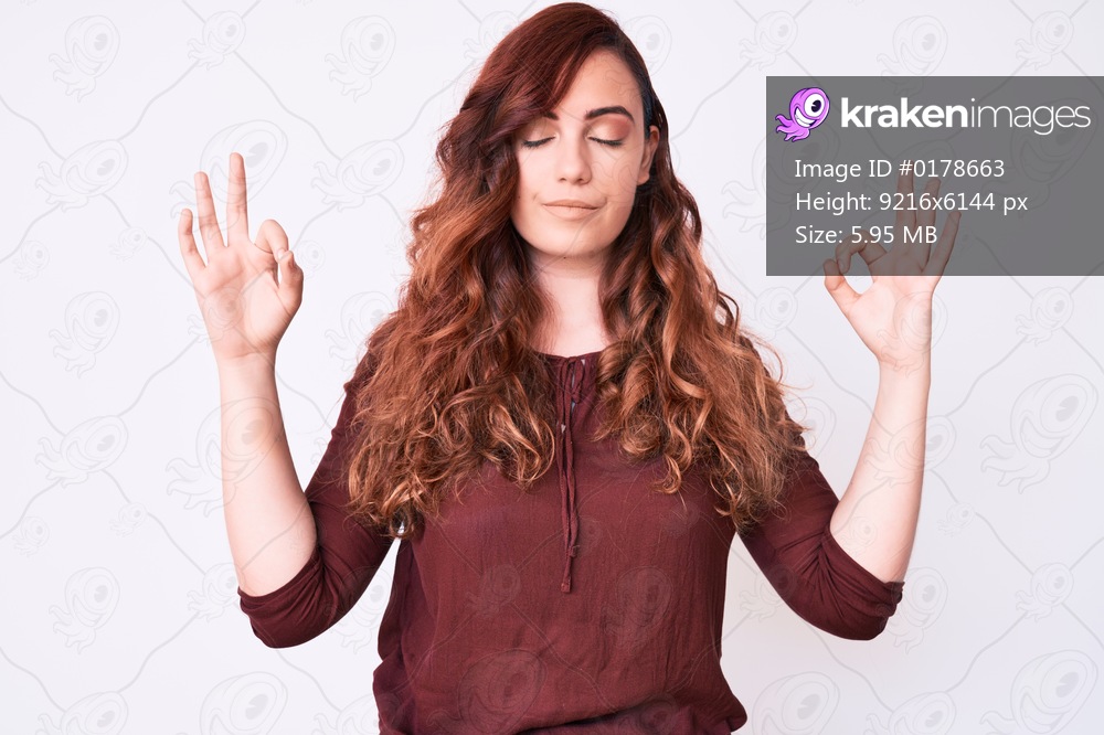 Young beautiful woman wearing casual clothes relax and smiling with eyes closed doing meditation gesture with fingers. yoga concept. 